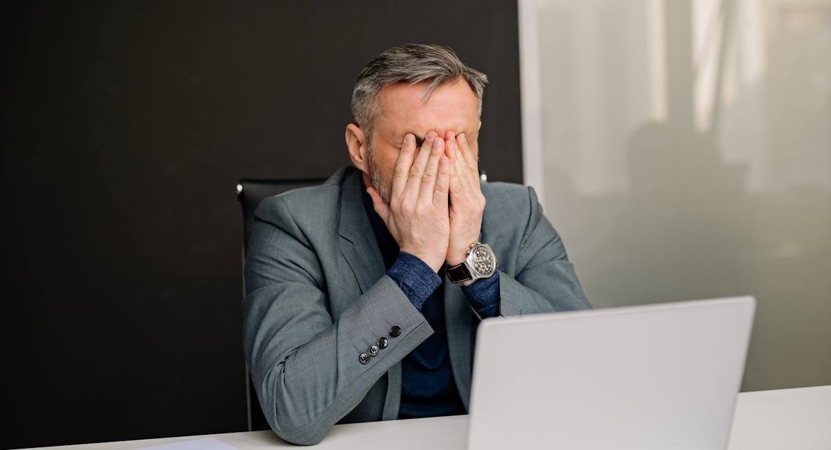 Businessperson analyzing lead generation data with magnifying glass